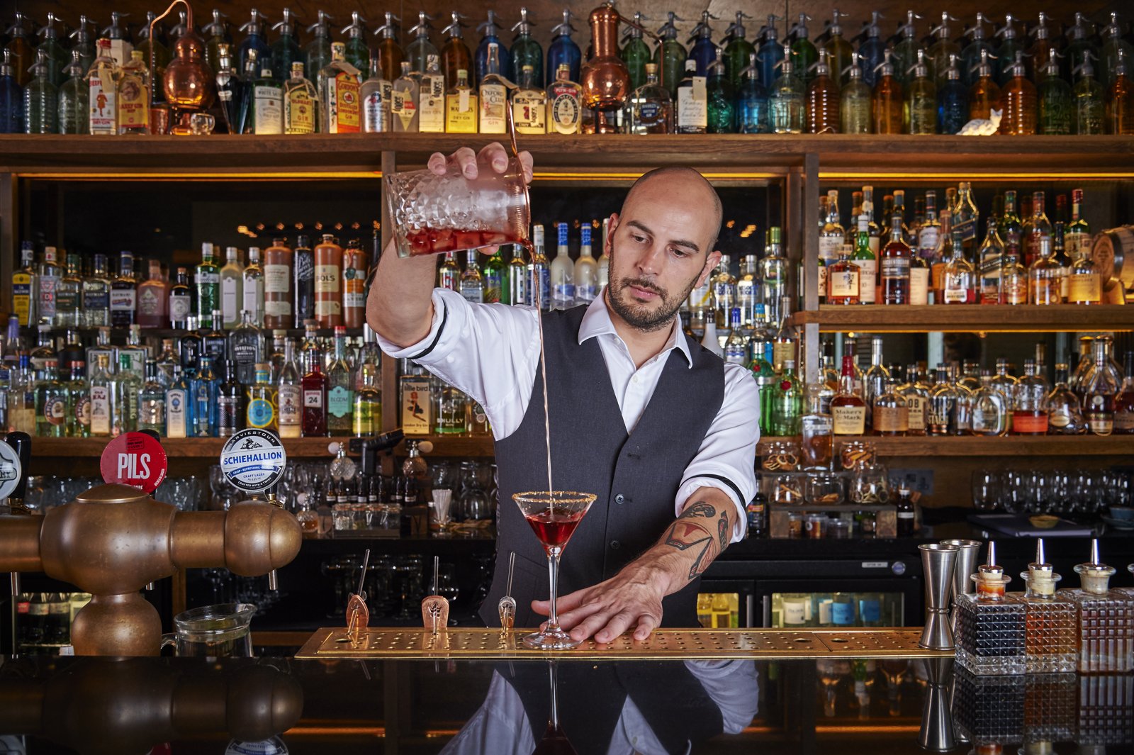 Instructor demonstrating a precise pour technique